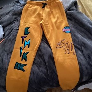 Yellow sweat pants. They are a size small and soft